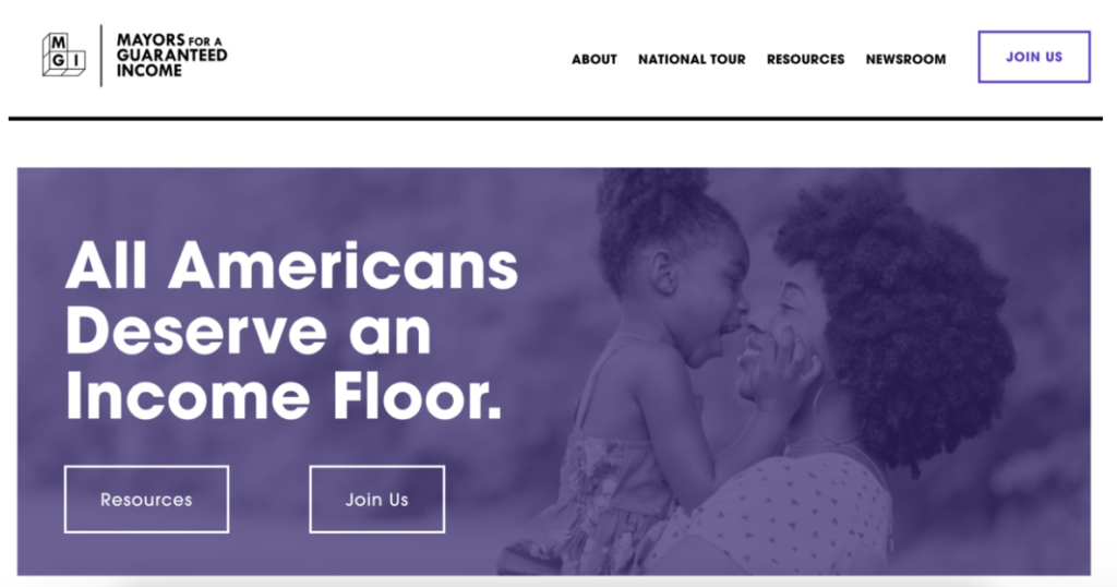 Photograph of a person holding small child, smiling at one another, with a purple overlay. Text: Mayors for a Guaranteed Income. All Americans Deserve an Income Floor. Resources. Join Us.