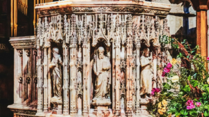 An exquisitely sculpted marble dais in The Cathedral of St. Nicholas in England.