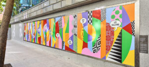 Mural of a variety of bright shapes and colors outside the Asian Art museum. 
