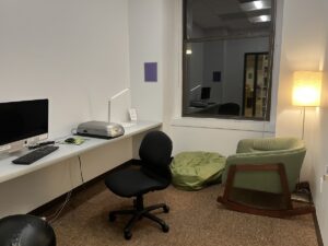 The Sensory Friendly Study Room, with desk, computer, and a variety of seating options and lamps.