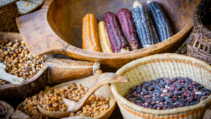 Colorful cobs of corn in a variety of baskets and bowls.