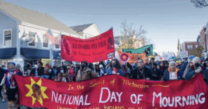 A crowd of people march on the National Day of Mourning in Massachusetts.
