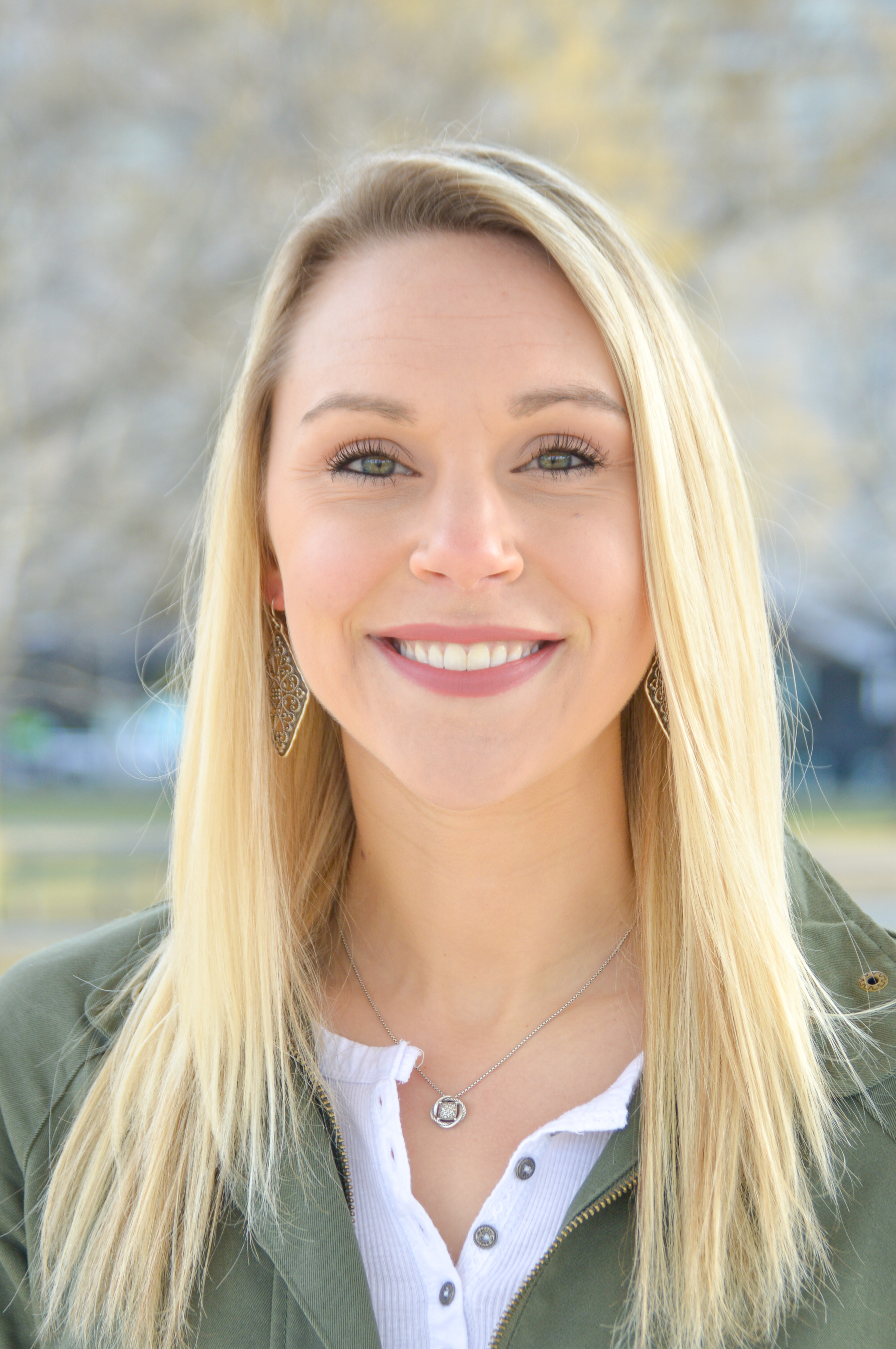 Haley Bresnahan smiling at the camera during a headshot photoshoot.