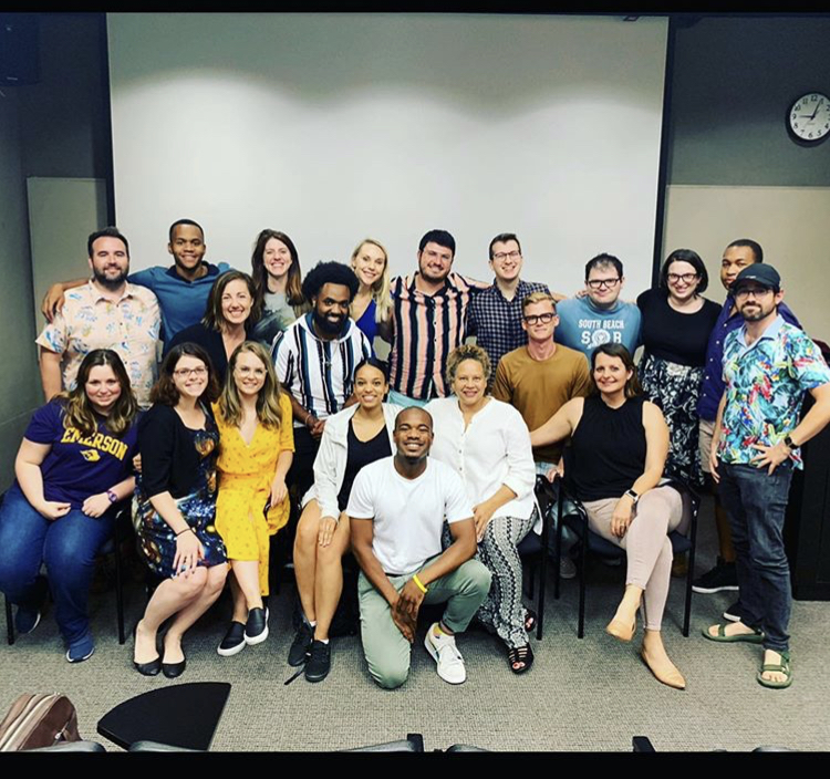 Haley Bresnahan smiles for a group picture with the rest of her Writing for Film and Television MFA program peers during a class