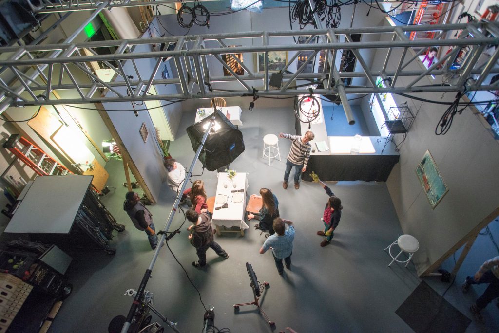 Film and Media Art students viewed from above, filming a project