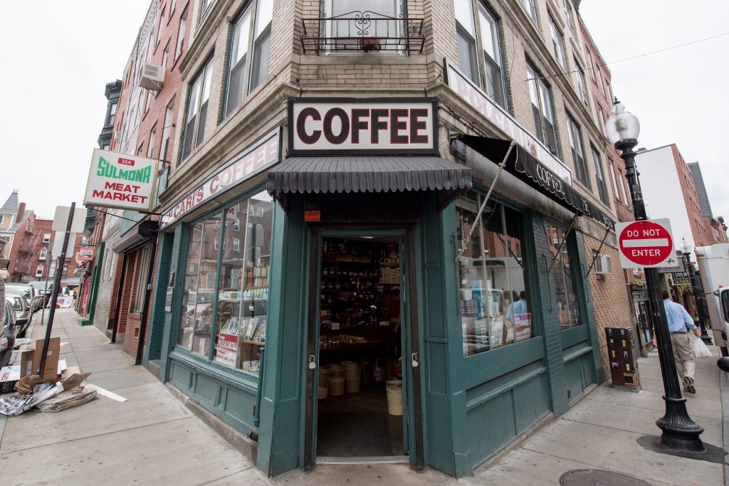 A building corner in the North End with a sign reading "COFFEE"