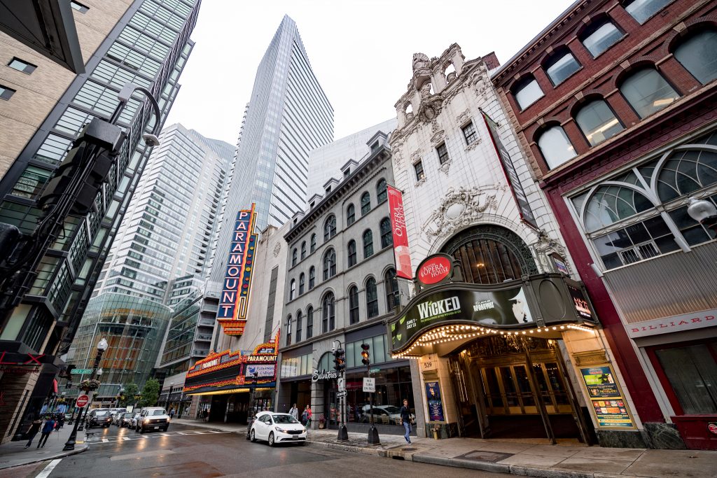 Street view of Paramount Theatre and the Opera House with marquees advertising "Wicked"  