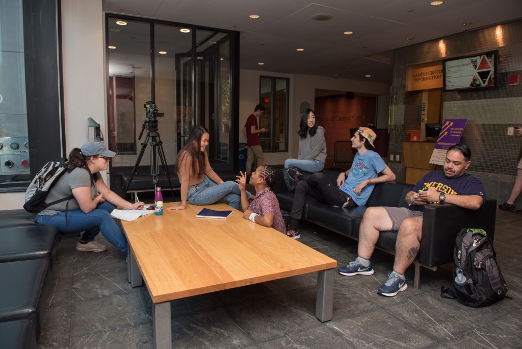 Graduate students gathering at the Piano Row Campus Center.