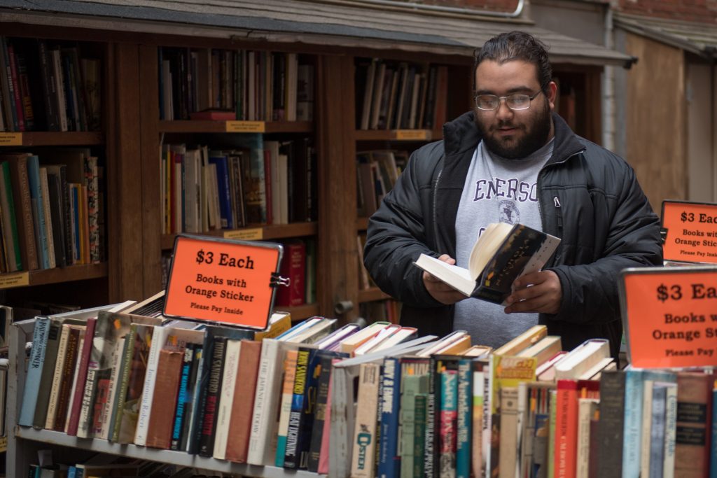 Creative arts graduate student shopping at Brattle Books. 