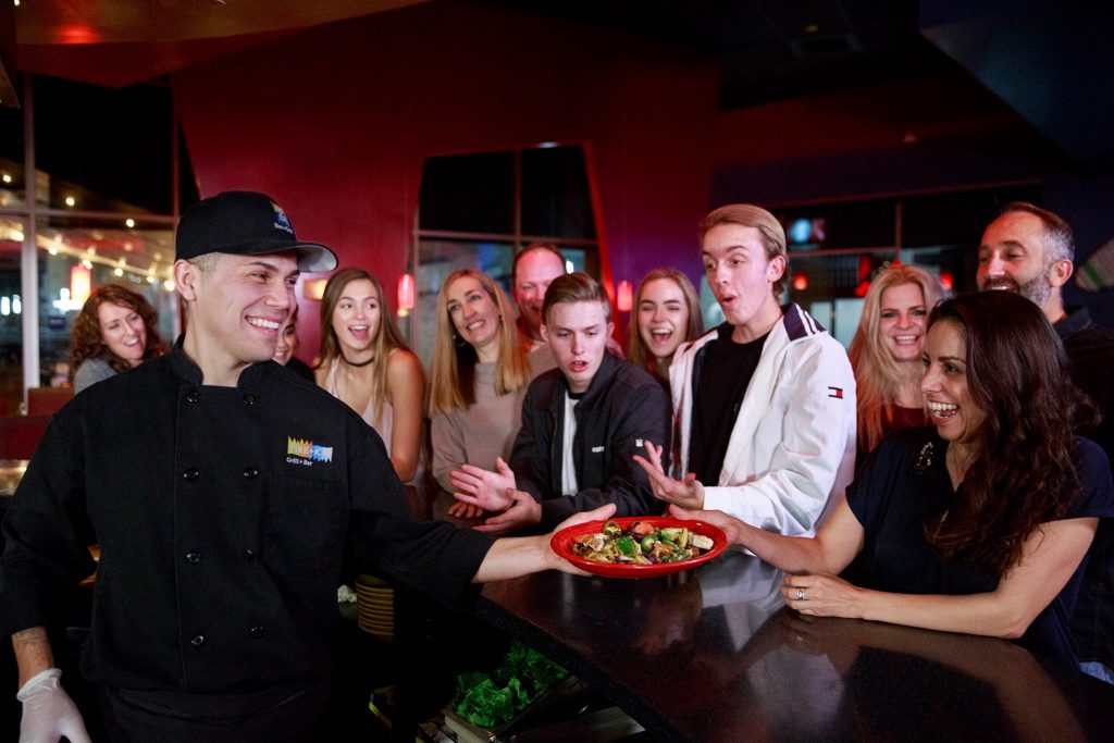 Students receive food at Fire+Ice. Photo by Fire+Ice.