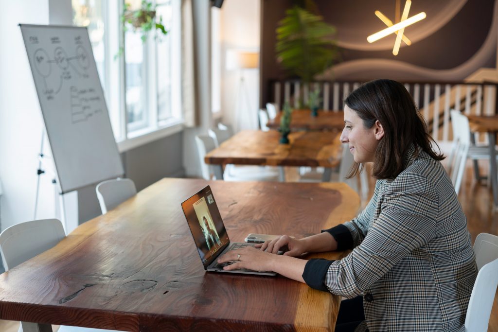 Student in professional attire attending a virtual meeting