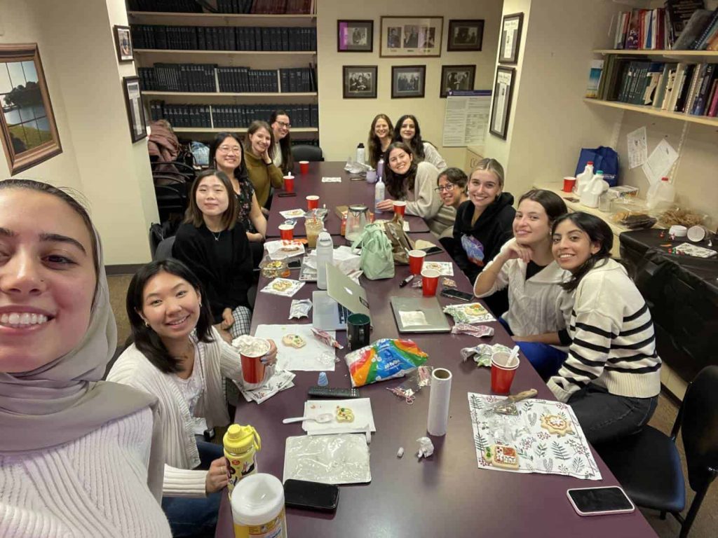 Members of BLLING in a conference room drinking hot chocolate