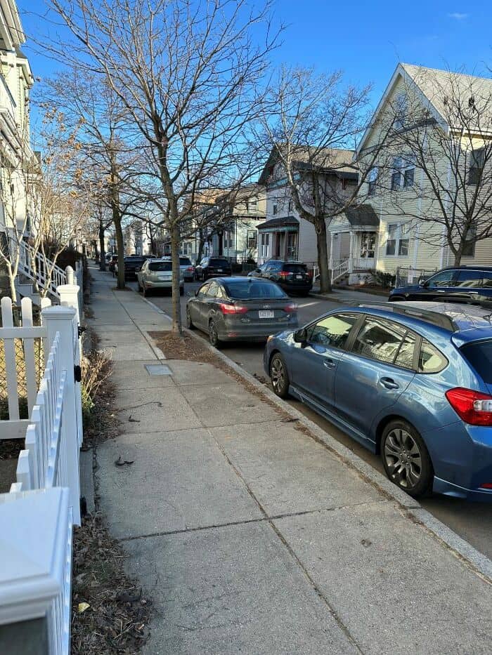 Houses in Savin Hill, with cars parked on the street