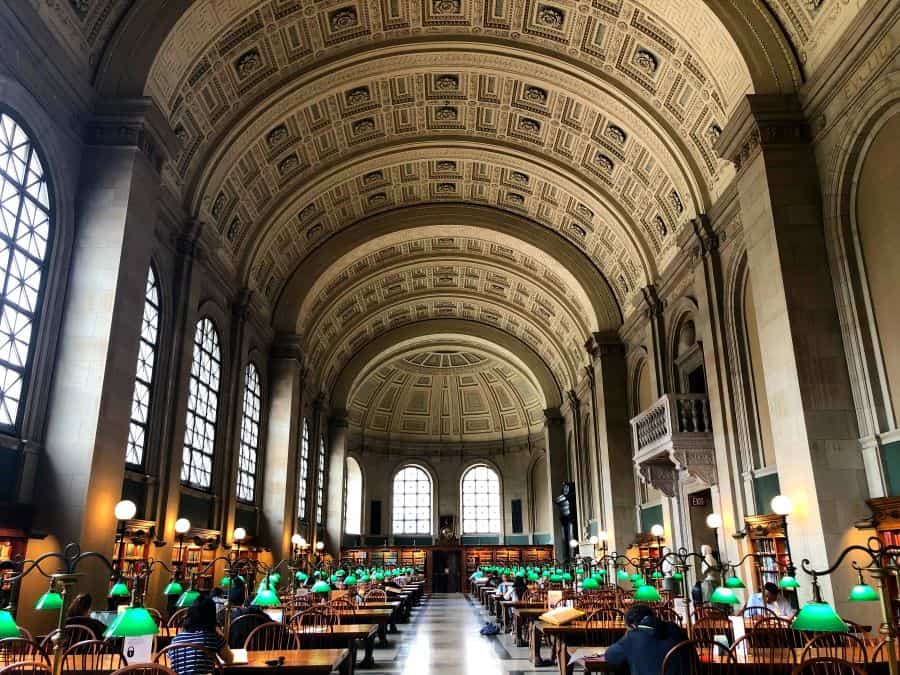 Study room with green lamps over desks in the Boston Public Library