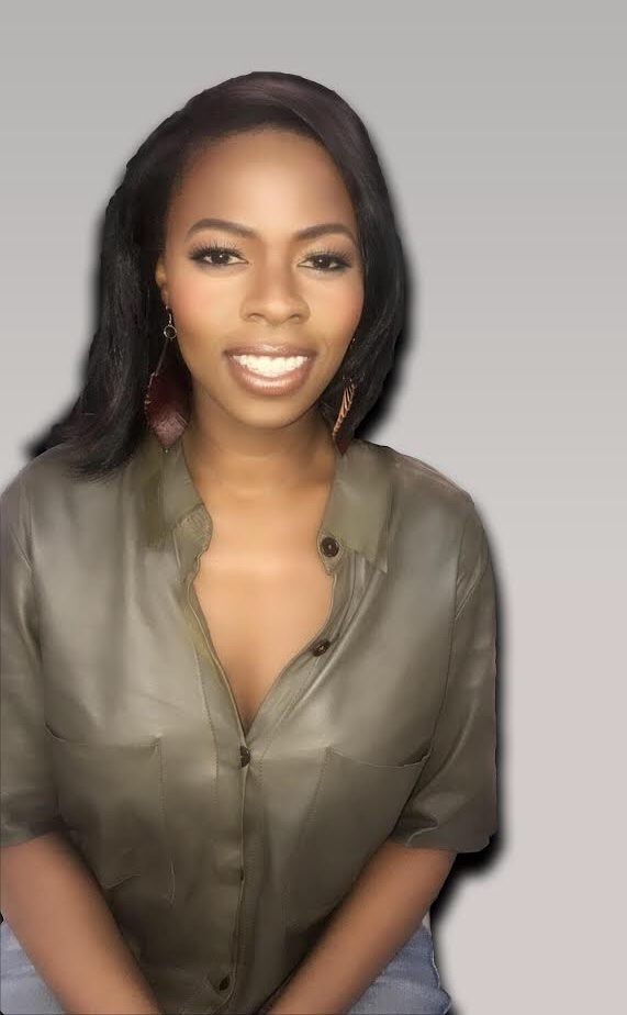 A professional headshot of Geotgette Pierre, smiling at the camera and wearing a silver button-down shirt