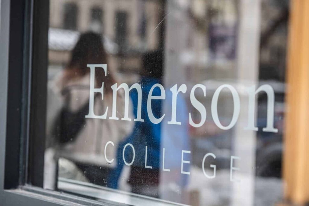 A window with "Emerson College" etched into the glass