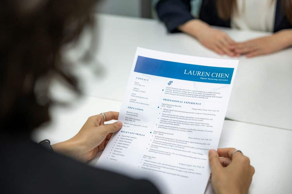 A hiring manager looks over an applicant's resume