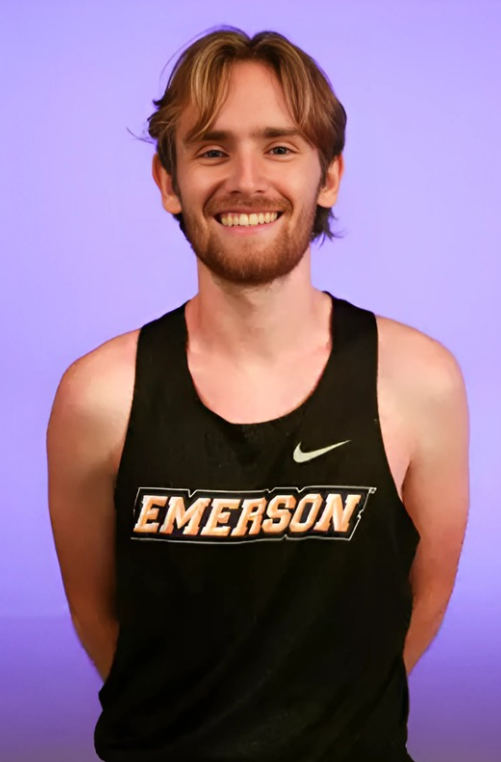 Headshot of Oliver Glass wearing an Emerson cross country jersey.