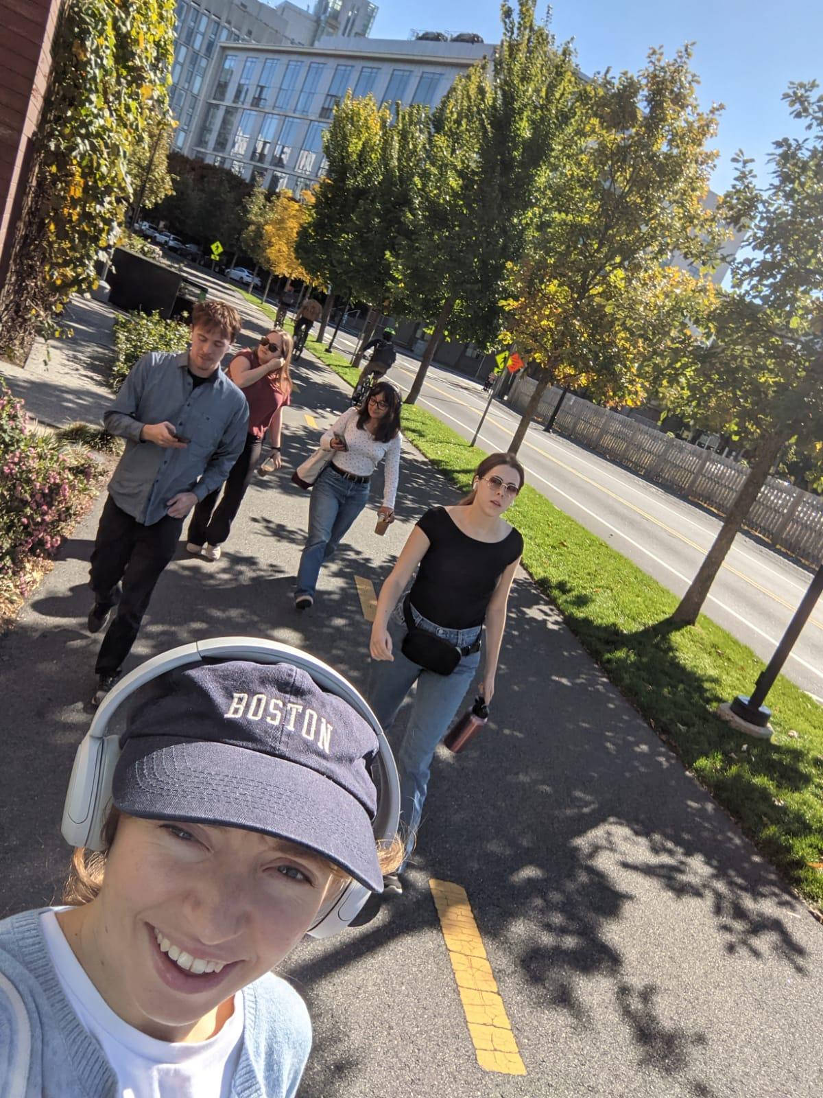 Selfie of five students walking outside to their next bookstore crawl location.