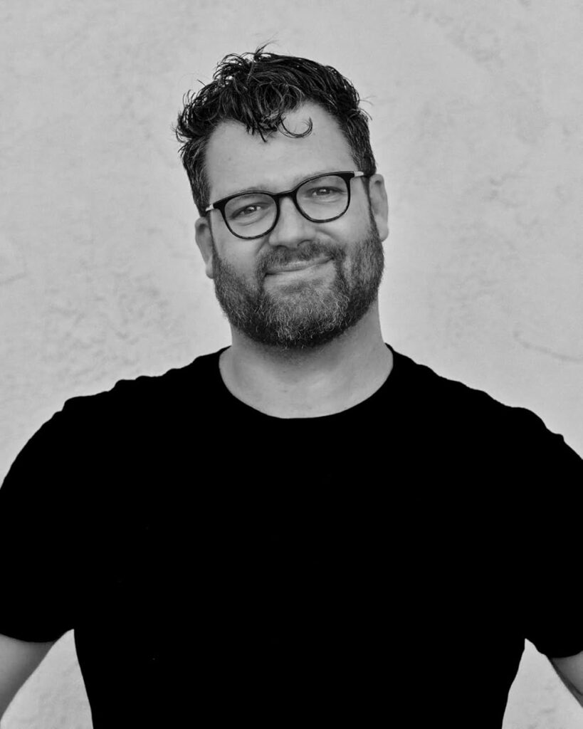 Black and white headshot of Jonaz McMillan.