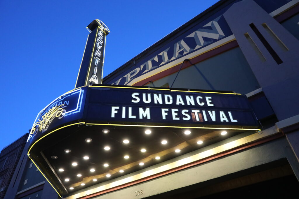 Outside of the theater with "Sundance Film Festival" lit up.