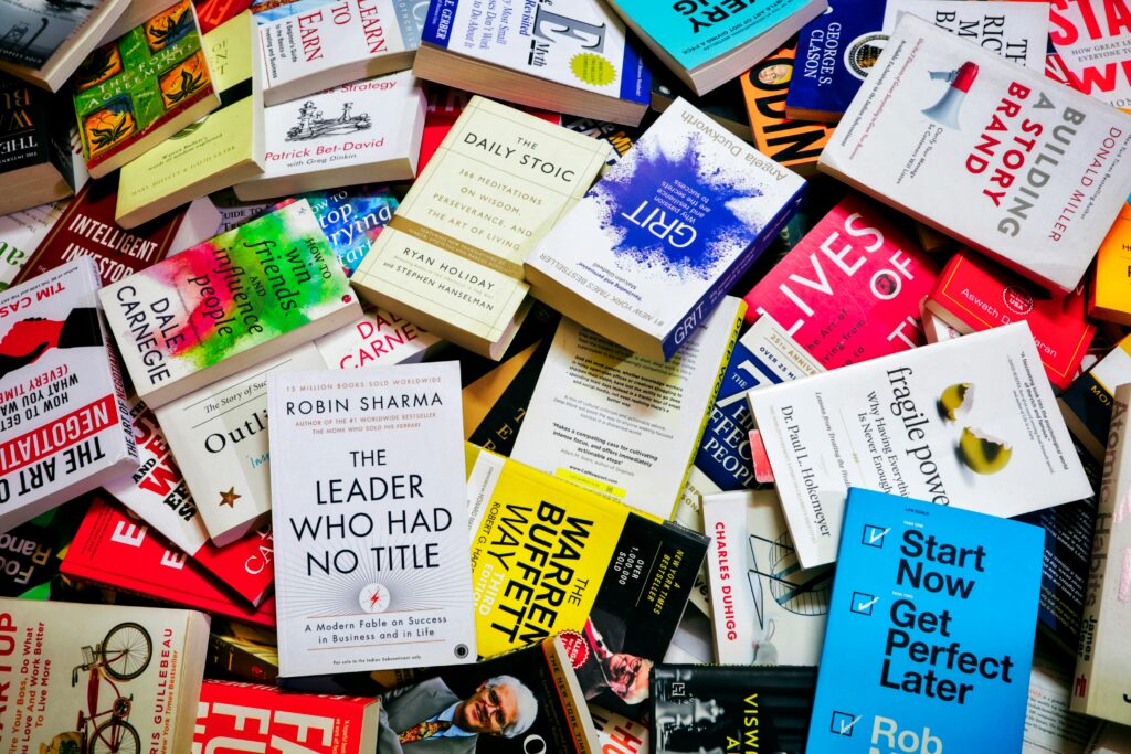 Self-help books layed out in a bundle.