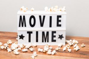 Lightbox that says Movie Time with popcorn surrounding it