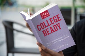 A person holding College Ready book
