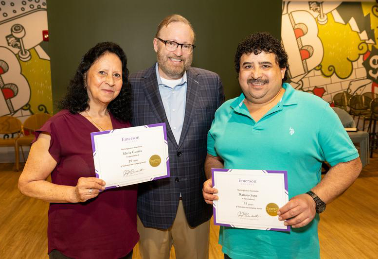 President Bernhardt posing with two staff members holding service certificates